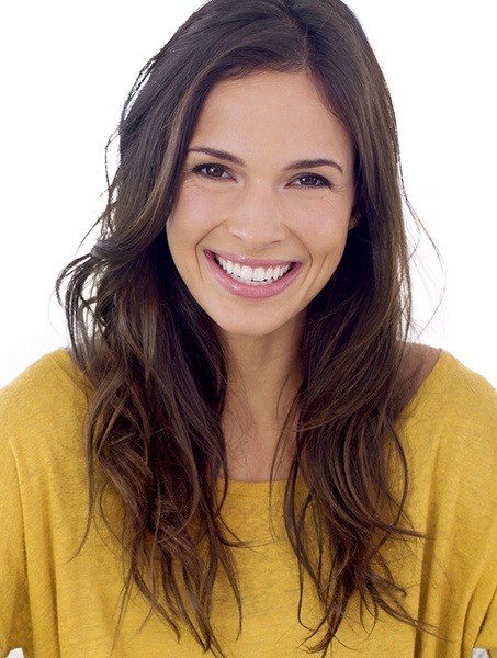 Woman with flawless smile after cosmetic dentistry