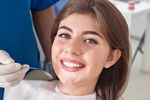 Woman smiling after cosmetic dental bonding