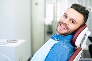 Man preventing dental emergencies in West Monroe by completing checkups