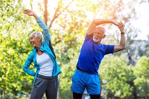 senior couple stretching before they exercise