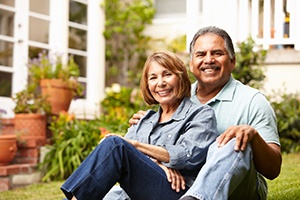 elderly couple sitting on their front porch
