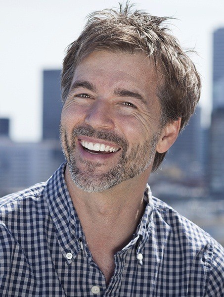 Older man with healthy attractive smile after oral surgery
