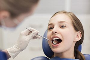 Young girl receiving children's dentistry exam