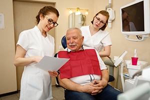Patient learning about the details of his full mouth reconstruction plan