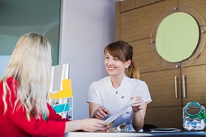 Patient learning about payment options for full mouth reconstruction