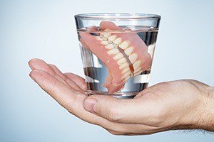 Full dentures in glass of water