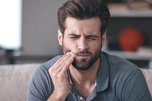 Man with a toothache in West Monroe