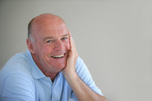 older man happy smiling blue shirt